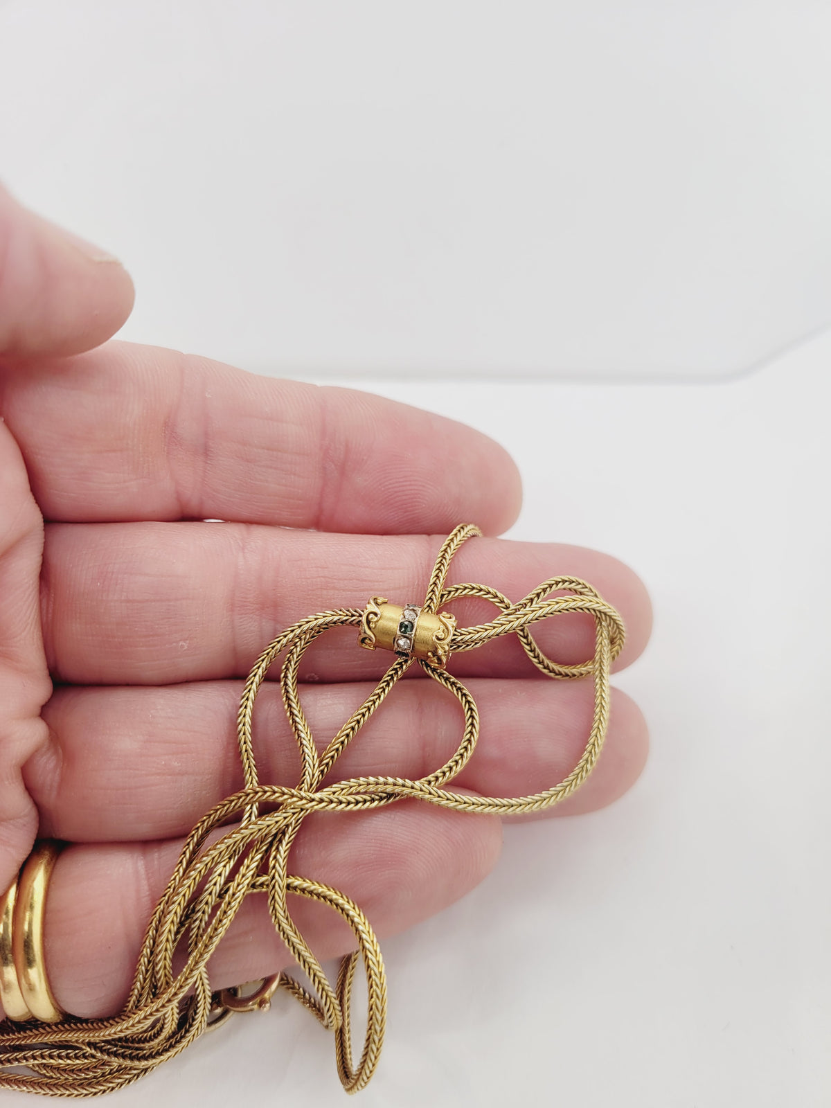 Antique long woven 15ct yellow gold chain with diamond and emerald slider
SKU: 8476